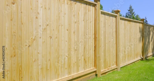 Establishing shot of fence built from wood in Vancouver, Canada, North America. Outdoor landscape. Security and privacy concept. Day time on June 2021. Still camera view. ProRes 422 HQ.