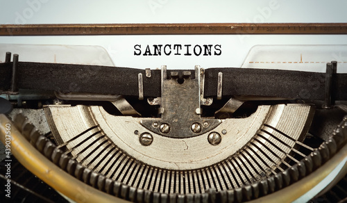 Schilderij op canvas The word sanctions written with a typewriter