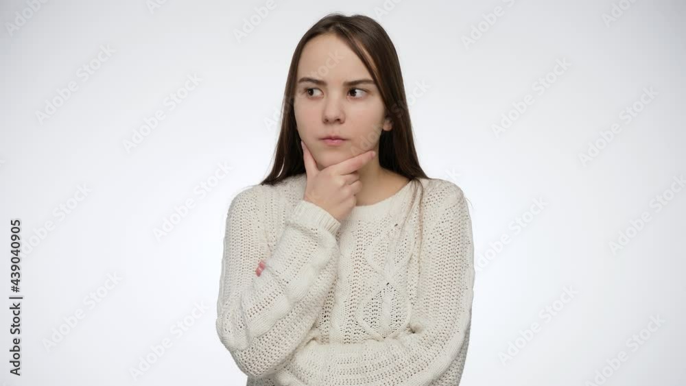 Studio portrait of thoughtful young hirl over white background Studio portrait of thoughtful young hirl over white background
