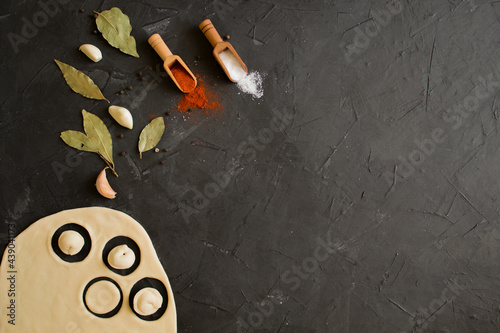 Uncooked Russian homemade dumplings or ravioli on the Board. The view from the top.