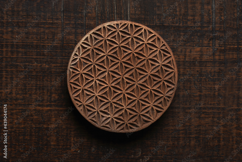 Flower of life shape Indian wood block pattern for textile printing on rustic wood background. Block Printing,Rajasthan India Block Printing, Wood block used for handmade textile printing,Hand craft