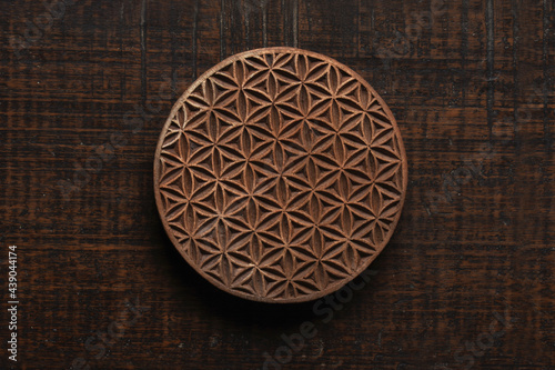 Flower of life shape Indian wood block pattern for textile printing on rustic wood background. Block Printing,Rajasthan India Block Printing, Wood block used for handmade textile printing,Hand craft