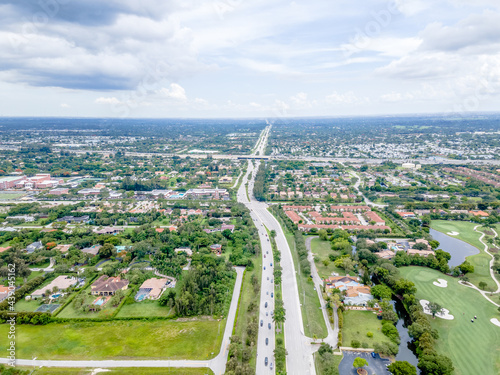 aerial drone of suburbs and city with highway

 photo