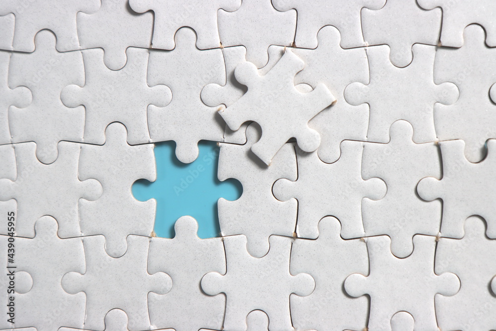 Jigsaw puzzle with missing piece. Missing puzzle pieces. Concept image of unfinished task. Completing final task, missing jigsaw puzzle pieces and business concept with a puzzle piece missing. blue Jigsaw puzzle with missing piece. Missing puzzle pieces. Concept image of unfinished task. Completing final task, missing jigsaw puzzle pieces and business concept with a puzzle piece missing. blue
