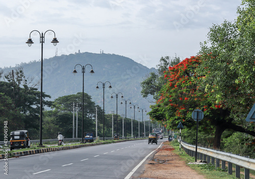 A Beautiful picture of  cleanest Mysuru cityscape with well laid roads and the Chamundi hills in the far background attracts the tourists in India. photo