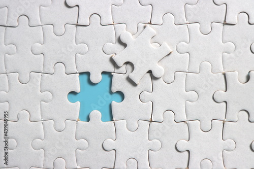Jigsaw puzzle with missing piece. Missing puzzle pieces. Concept image of unfinished task. Completing final task, missing jigsaw puzzle pieces and business concept with a puzzle piece missing. blue