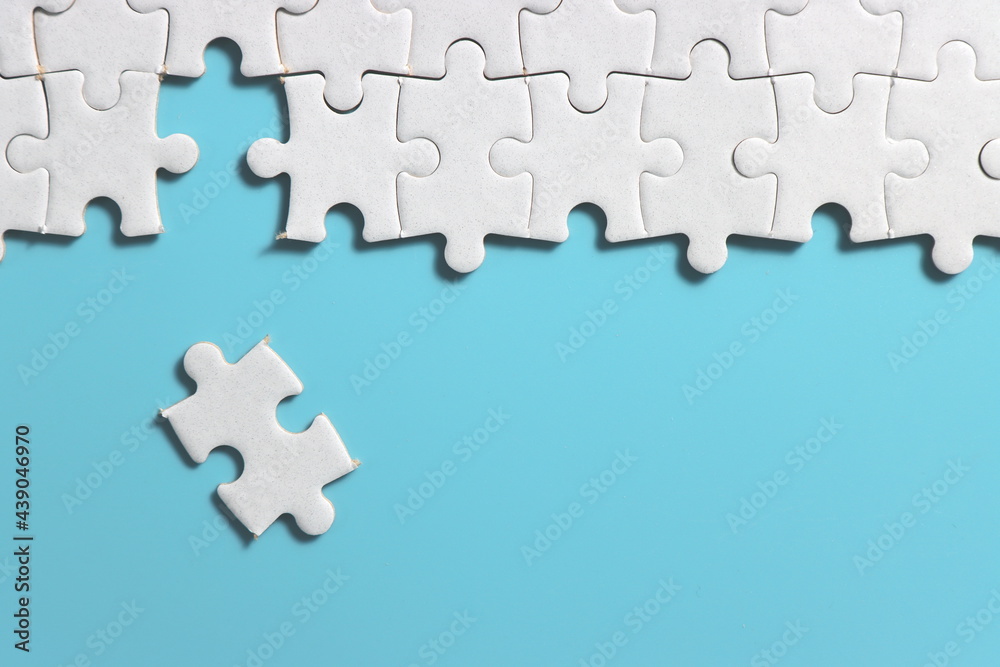 Jigsaw puzzle with missing piece. Missing puzzle pieces. Concept image of unfinished task. Completing final task, missing jigsaw puzzle pieces and business concept with a puzzle piece missing. blue Jigsaw puzzle with missing piece. Missing puzzle pieces. Concept image of unfinished task. Completing final task, missing jigsaw puzzle pieces and business concept with a puzzle piece missing. blue