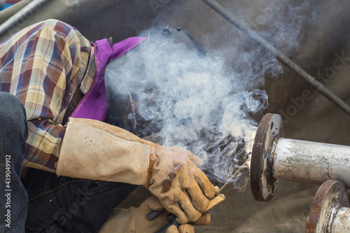 Male welder worker pipeline