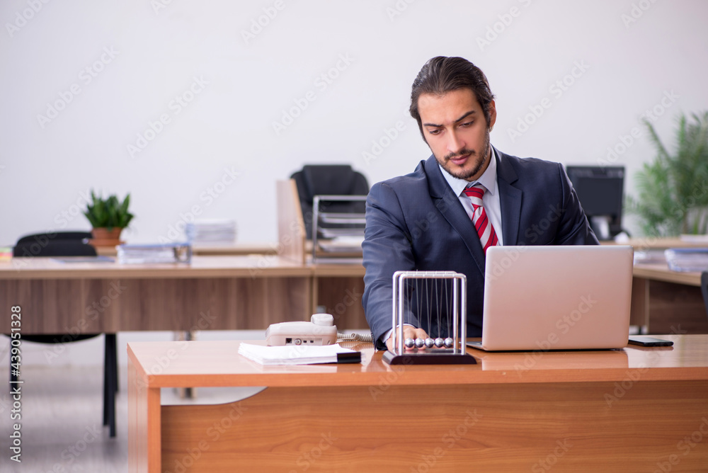 Young man businessman employee sitting in the office Young man businessman employee sitting in the office