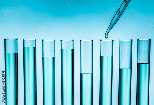 Pipette dropping liquid into test tube