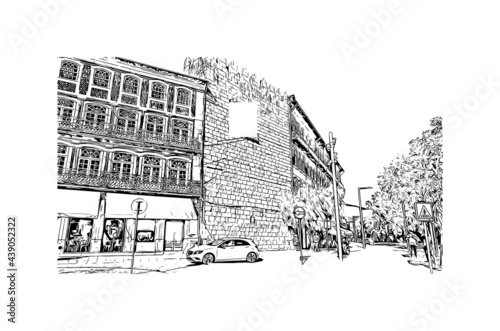 Building view with landmark of Guimaraes is a city in northern Portugal. Hand drawn sketch illustration in vector.