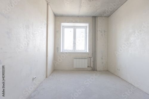 Fototapeta Naklejka Na Ścianę i Meble -  interior of the apartment without decoration in gray colors