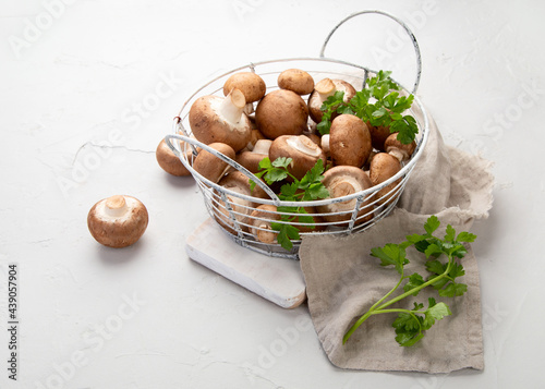 Champinion mushrooms on light background. Vegan food concept. photo