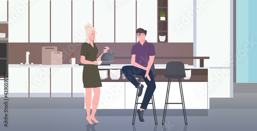 young couple drinking coffee man woman spending time together stay home coronavirus pandemic