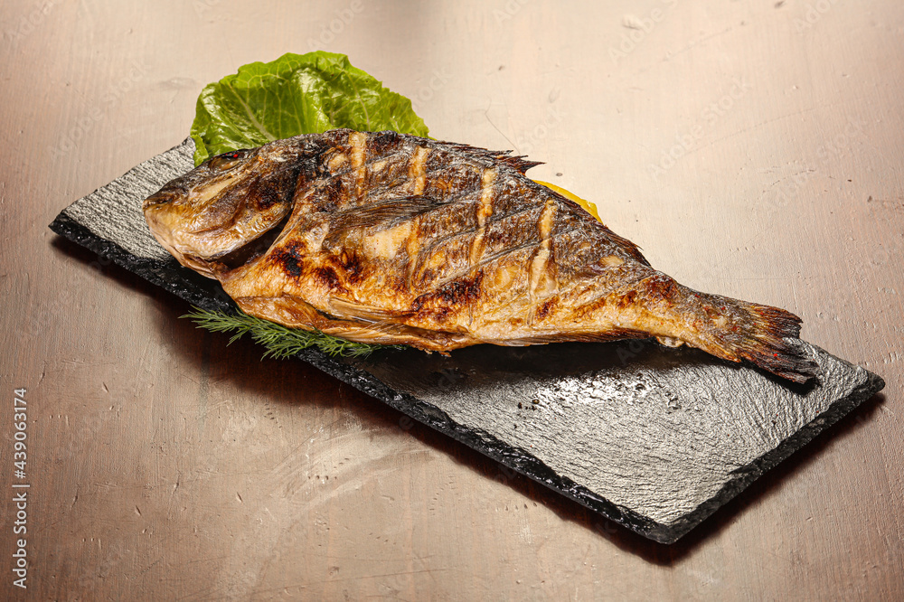 Grilled dorada servel lemon slice Grilled dorada servel lemon slice