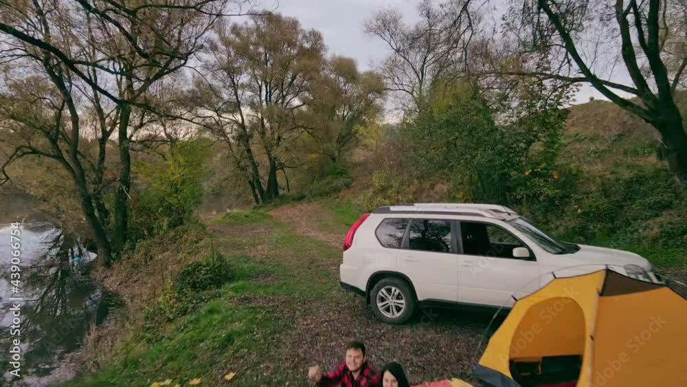 couple resting at autumn camping site shooting on drone couple resting at autumn camping site shooting on drone