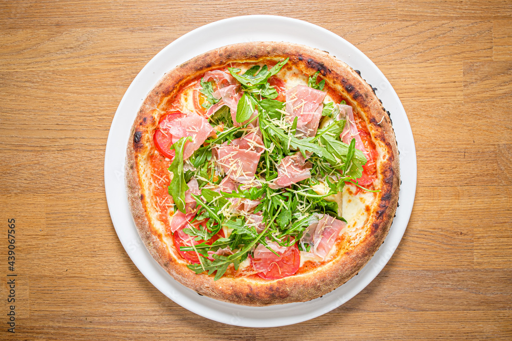 italian pizza on the wooden background italian pizza on the wooden background