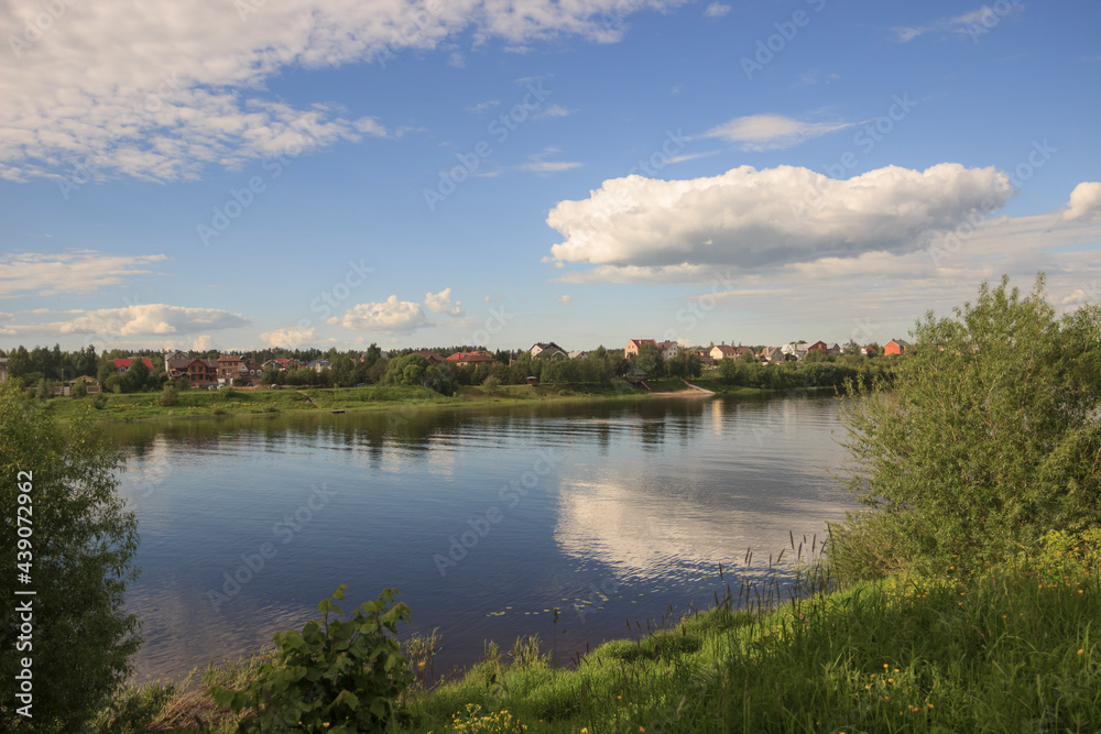 Reflection of a cloud in the river. Summer. Volga river. Tver region.