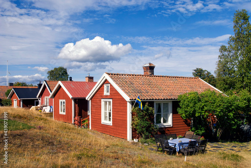 Traditional red painted houses in the Swedish village Holick photo