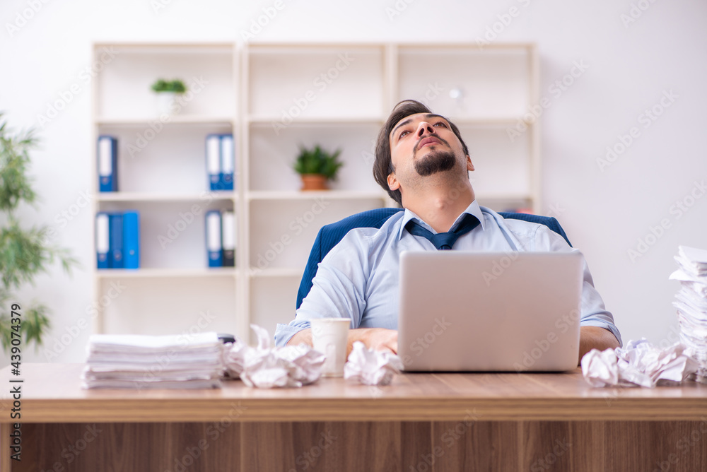 Young male employee rejecting new ideas in the office Young male employee rejecting new ideas in the office