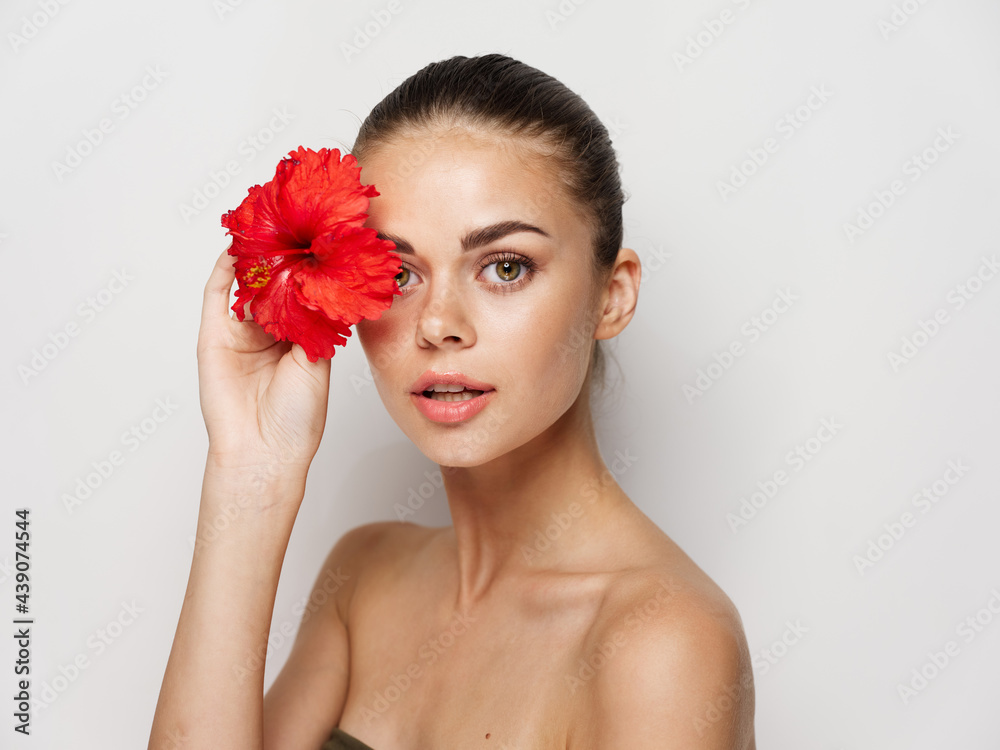 pretty woman nude shoulders red flower near face cosmetics pretty woman nude shoulders red flower near face cosmetics