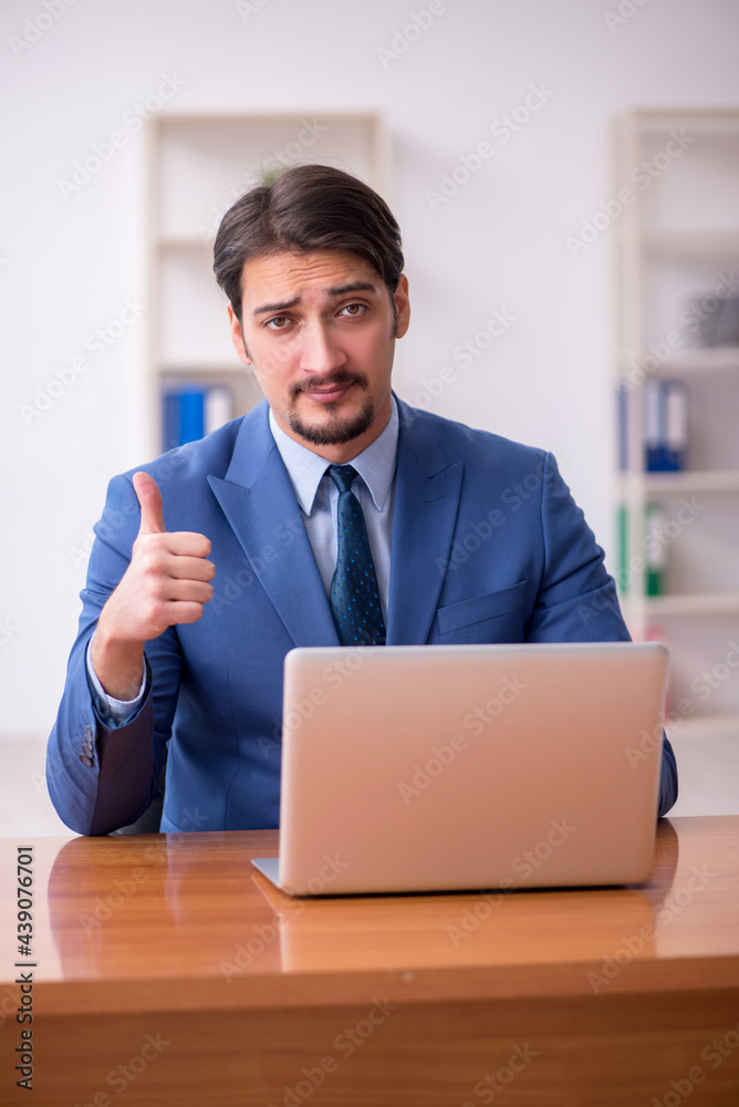 Young businessman employee working in the office Young businessman employee working in the office