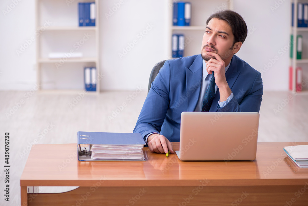 Young businessman employee working in the office Young businessman employee working in the office