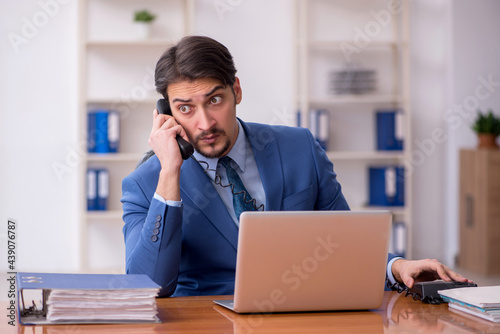 Young businessman employee working in the office