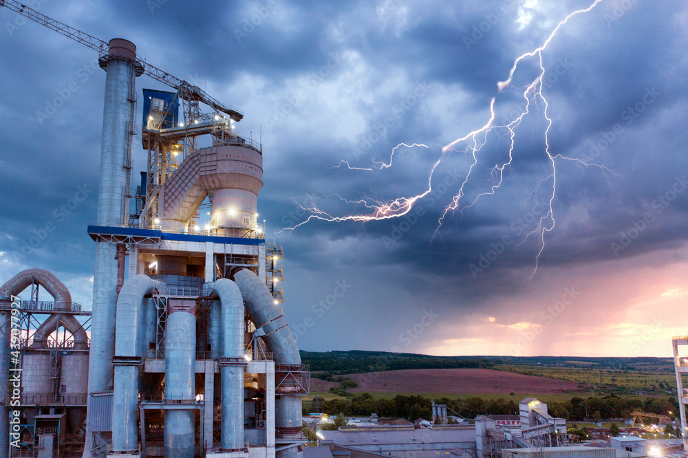Night plant in storm and lightning
