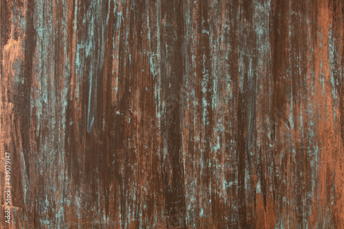 The texture of the copper background is covered with a blue patina 