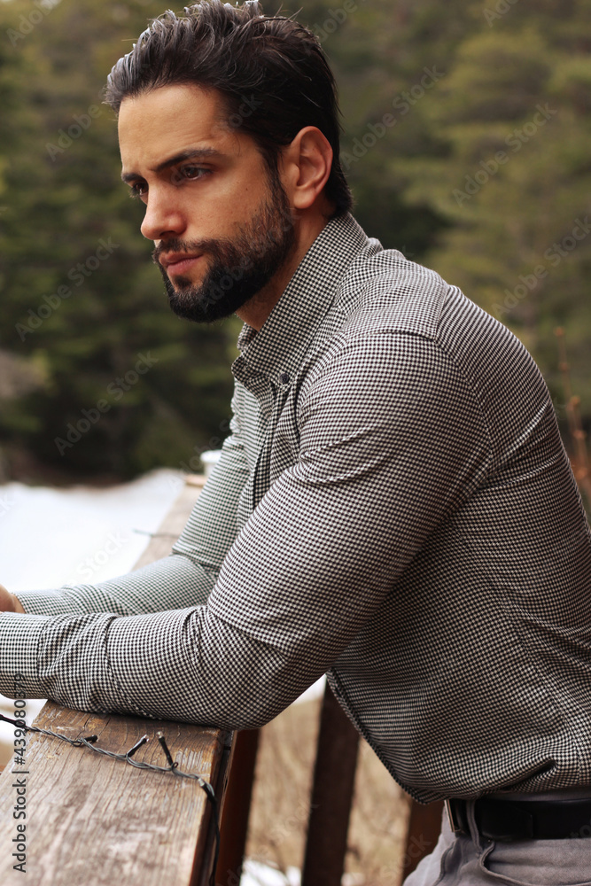 handsome bearded man wearing a shirt outdoor
