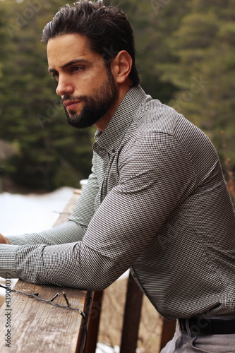 handsome bearded man wearing a shirt outdoor