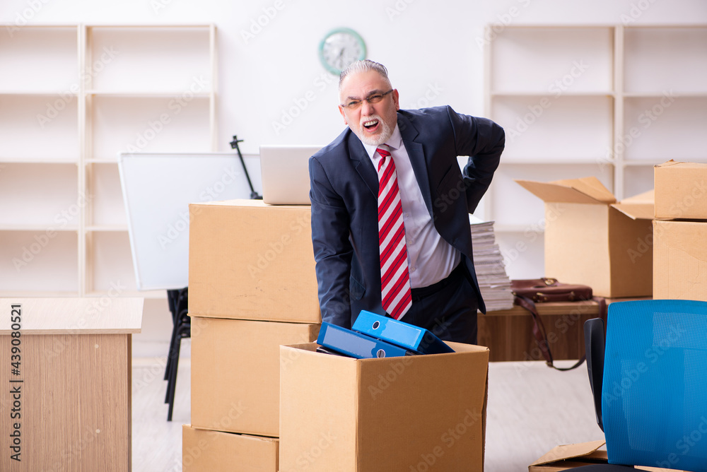 Old businessman employee in relocation concept Old businessman employee in relocation concept