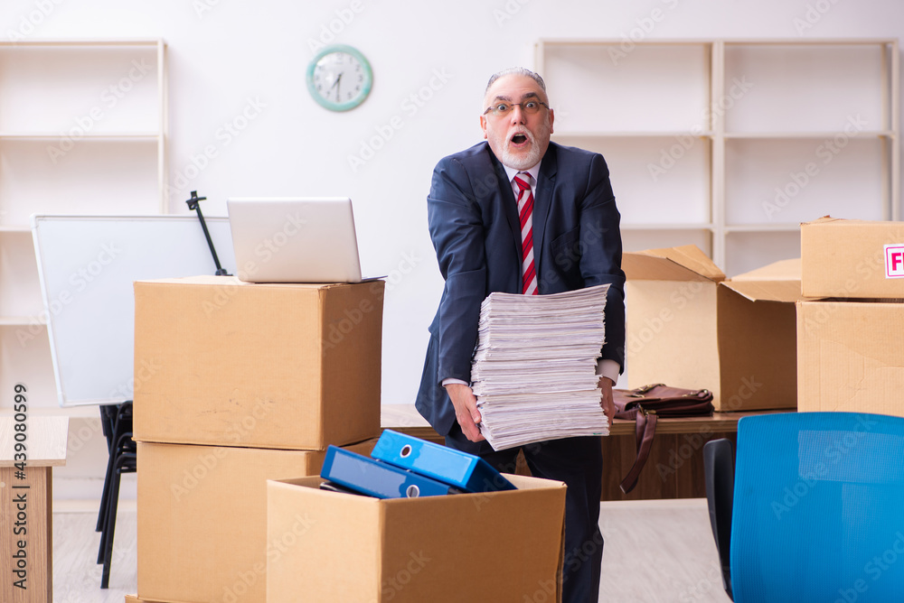 Old businessman employee in relocation concept Old businessman employee in relocation concept