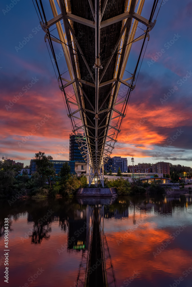 Nice perspective under a modern bridge during sunset