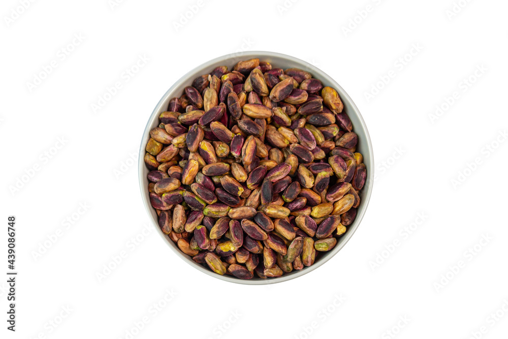 pistachios in bowl on white background close up pistachios in bowl on white background close up