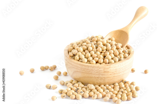 Dry organic soybean seed in wooden bowl on white background