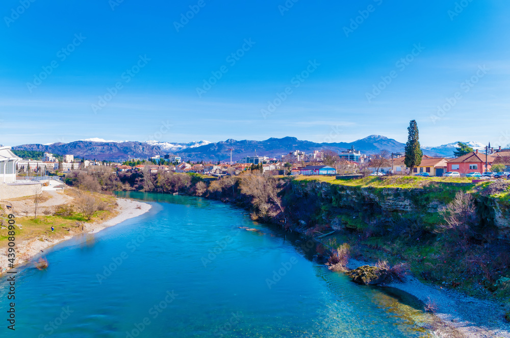 Scenic view of the Morača River and building against sky