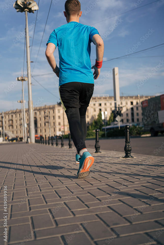 Man running in the city. Fitness workout, sport lifestyle concept. Man running in the city. Fitness workout, sport lifestyle concept.