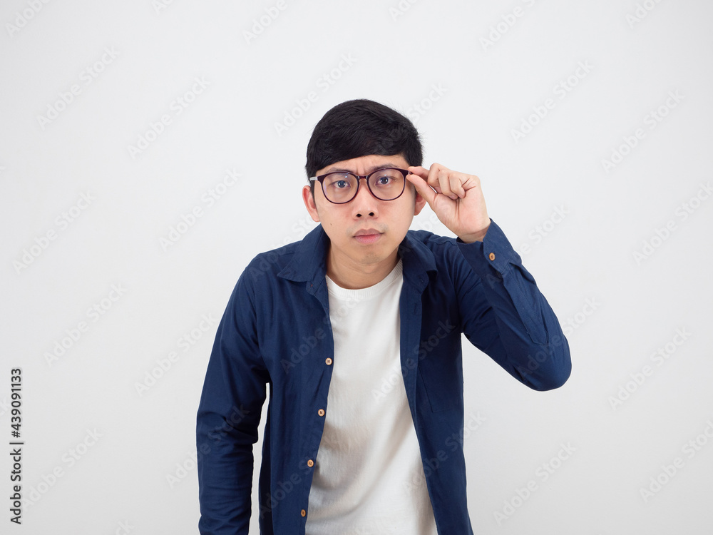Man wearing glasses feeling doubt looking at camera portrait on white background Man wearing glasses feeling doubt looking at camera portrait on white background