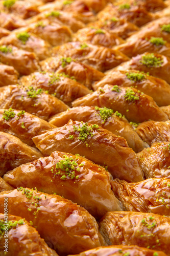 Turkish desert baklava with peanut, pistachio for holiday or ramadan. Traditional Middle Eastern Flavors. Selective focus, pattern.