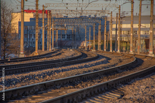 the branching of railways against the background of evening sunlight