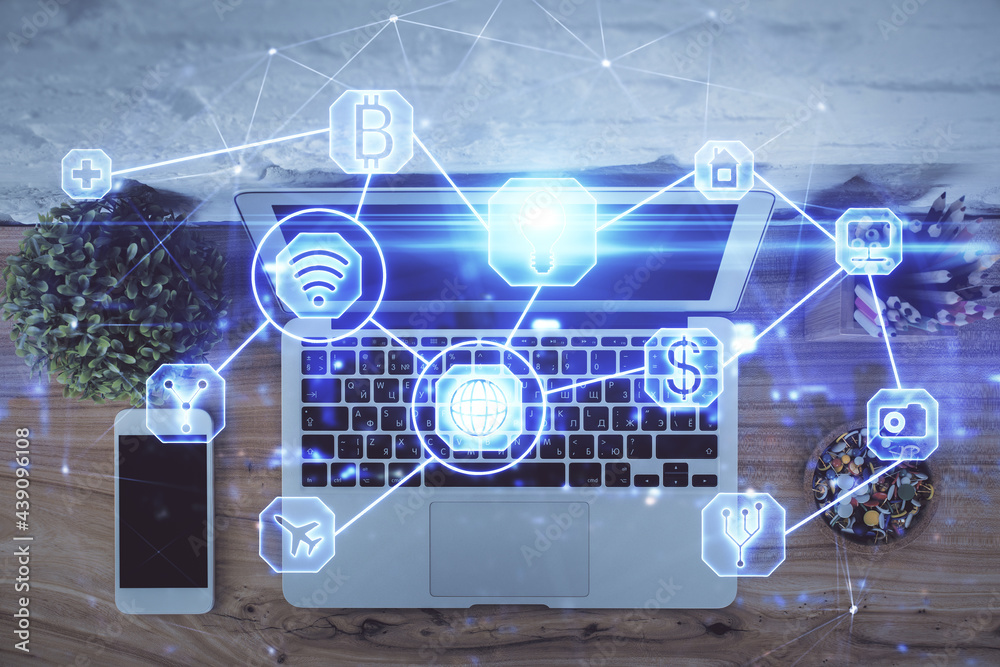 Social network hologram drawings over computer on the desktop background. Top view. Multi exposure. Concept of people connection.