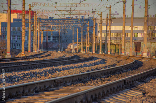the branching of railways against the background of evening sunlight