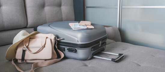 Travel. Online travel plans with Covid passport and Covid test. Traveling after quarantine, lockdown, covid 19. Staycation.local travel new normal.Girl packs baggage in suitcase and travel documents