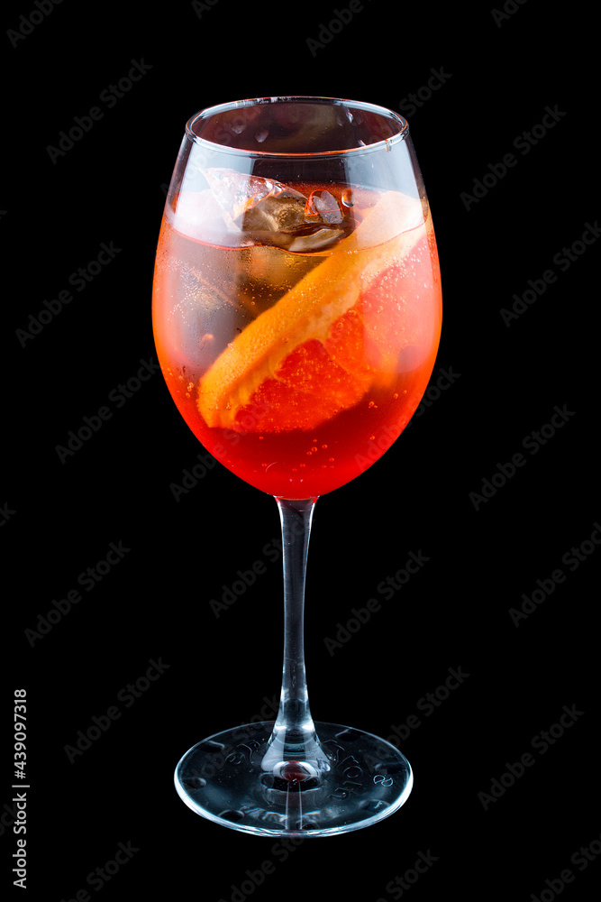 Aperol Spritz cocktail with grapefruit on a dark background. Isolated Aperol Spritz cocktail with grapefruit on a dark background. Isolated