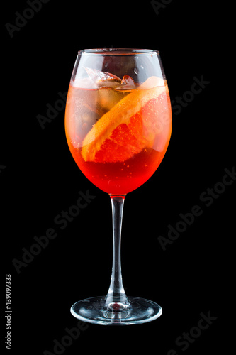 Aperol Spritz cocktail with grapefruit on a dark background. Isolated