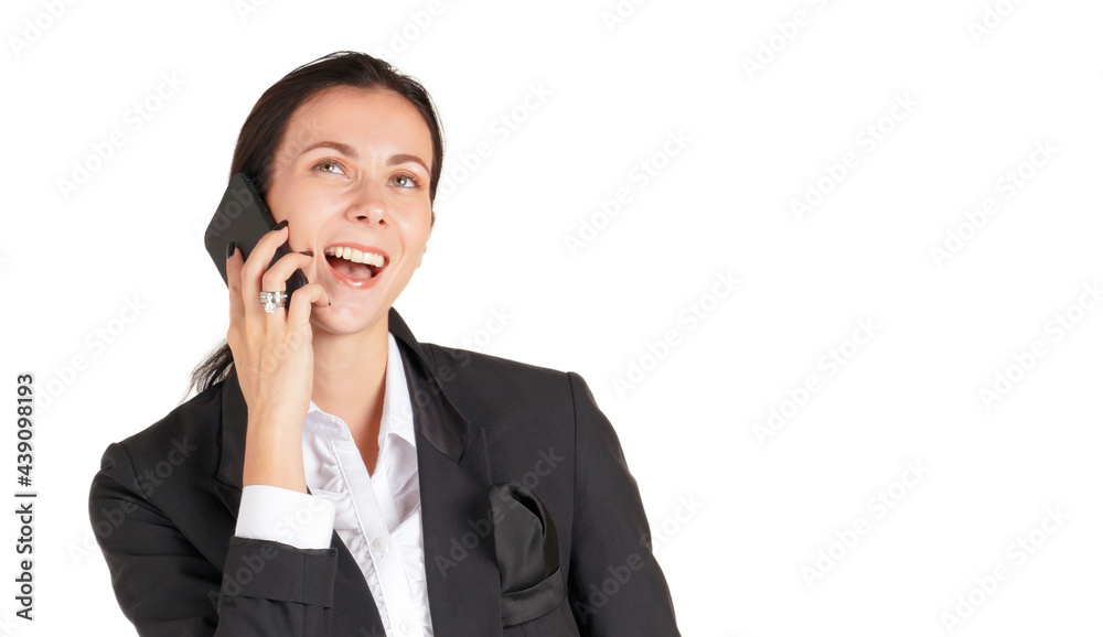 Young women in black suit with a smile talking to business partner via mobile phone. Portrait on white background with studio light. Close up Young women in black suit with a smile talking to business partner via mobile phone. Portrait on white background with studio light. Close up