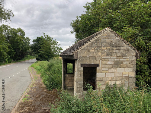 stone bus stop on a country lane in UK