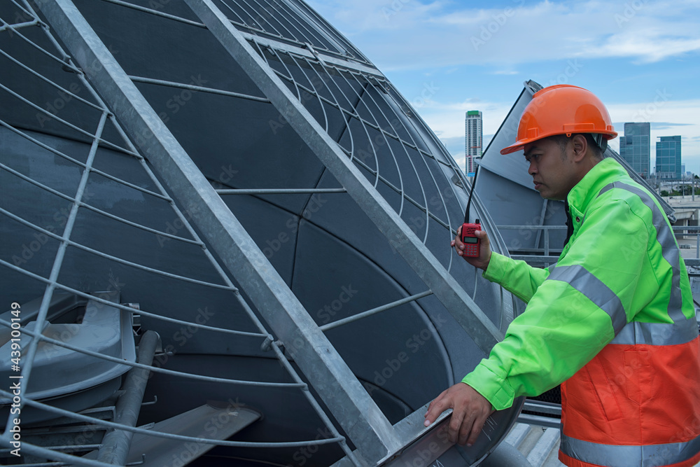 worker on a construction site. worker checking cooling tower. worker walk on Cooling tower plant with checking job.